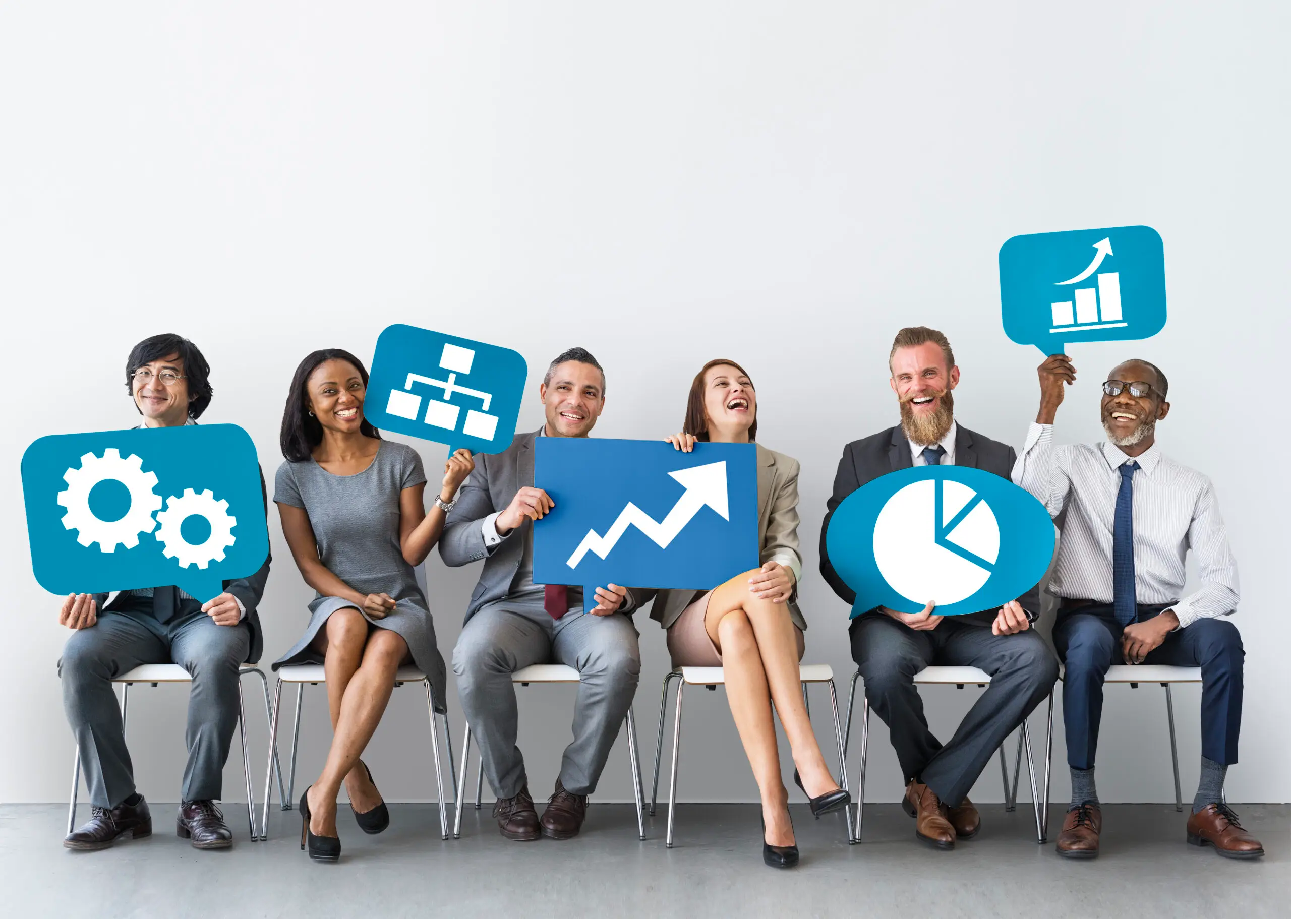 Diverse business professionals holding icons representing gears, strategy, growth, and analytics, highlighting teamwork and business optimization.